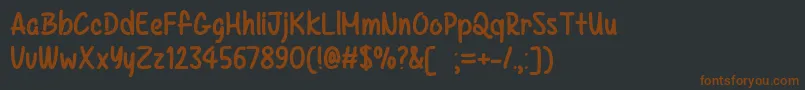 Шрифт KazincbarcikaTtf – коричневые шрифты на чёрном фоне
