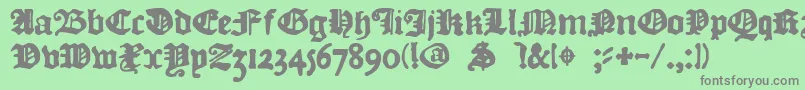 フォントDkCourant – 緑の背景に灰色の文字