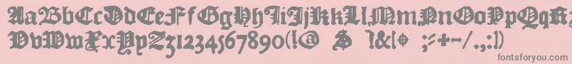 フォントDkCourant – ピンクの背景に灰色の文字