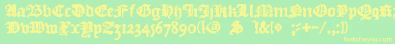 フォントDkCourant – 黄色の文字が緑の背景にあります