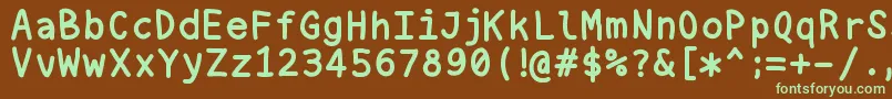 フォントNukamono – 緑色の文字が茶色の背景にあります。