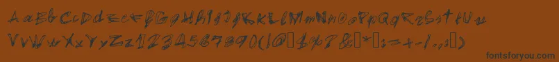 EgidovalHandstyle1-Schriftart – Schwarze Schriften auf braunem Hintergrund