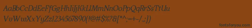 フォントKraskarioItalic – 黒い文字が茶色の背景にあります