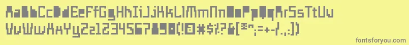 フォントTemploExtranjero – 黄色の背景に灰色の文字