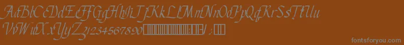 ChanceryCursive-fontti – harmaat kirjasimet ruskealla taustalla