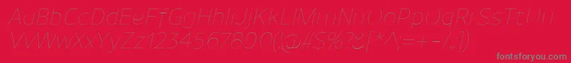 Fonte UnimanUltralightitalic – fontes cinzas em um fundo vermelho