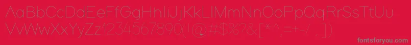 フォントAdam – 赤い背景に灰色の文字