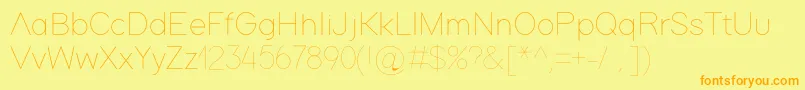 フォントAdam – オレンジの文字が黄色の背景にあります。
