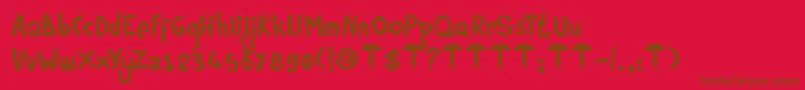 DkRumpelstiltskin-Schriftart – Braune Schriften auf rotem Hintergrund