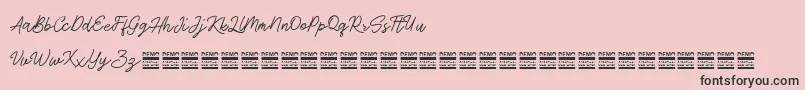 AntiqueDemo-Schriftart – Schwarze Schriften auf rosa Hintergrund