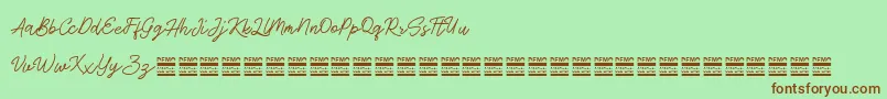 AntiqueDemo Font – Brown Fonts on Green Background