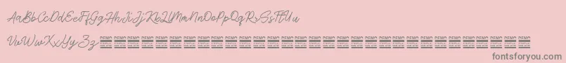 AntiqueDemo-Schriftart – Graue Schriften auf rosa Hintergrund