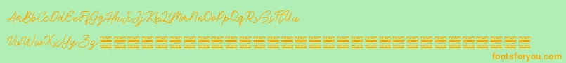 AntiqueDemo Font – Orange Fonts on Green Background