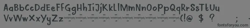フォントDkMamaBear – 黒い文字の灰色の背景