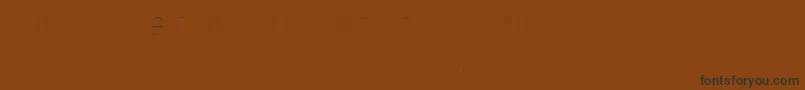 Czcionka FirasanscondensedTwo – czarne czcionki na brązowym tle