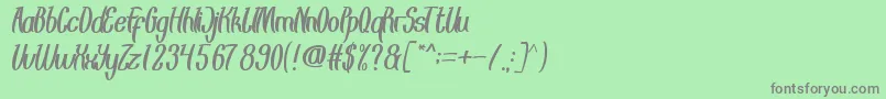 フォントEyesBeliever – 緑の背景に灰色の文字