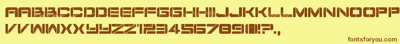 フォントDamageInc – 茶色の文字が黄色の背景にあります。