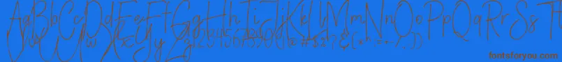 VerticalBrushyFree-Schriftart – Braune Schriften auf blauem Hintergrund