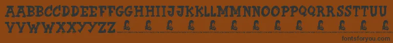 Czcionka ButterFinger – czarne czcionki na brązowym tle
