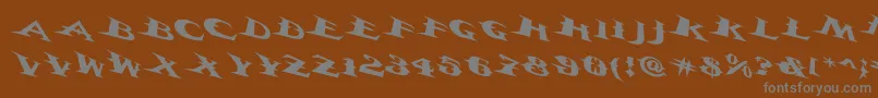 Vtcbelialsbladetricked-fontti – harmaat kirjasimet ruskealla taustalla