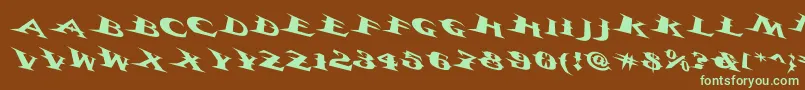 フォントVtcbelialsbladetricked – 緑色の文字が茶色の背景にあります。