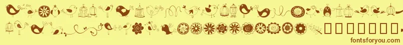 DoodleDings1BirdsCages-fontti – ruskeat fontit keltaisella taustalla