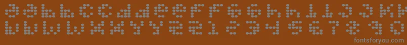 Propellerfuel-fontti – harmaat kirjasimet ruskealla taustalla