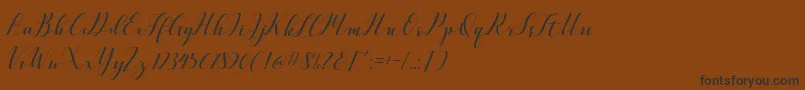 フォントVellesaScriptDemo – 黒い文字が茶色の背景にあります