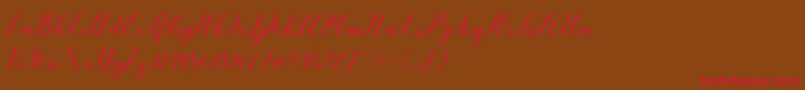 フォントVellesaScriptDemo – 赤い文字が茶色の背景にあります。
