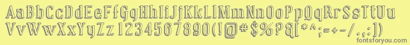 Sfcovingtonshadow-fontti – harmaat kirjasimet keltaisella taustalla