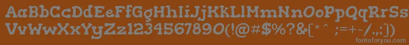 GorditasRegular-Schriftart – Graue Schriften auf braunem Hintergrund