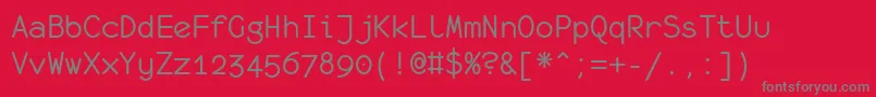 Monof55-Schriftart – Graue Schriften auf rotem Hintergrund