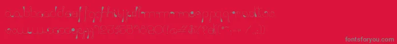 LickingDrops-Schriftart – Graue Schriften auf rotem Hintergrund