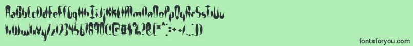 フォントQuillexs – 緑の背景に黒い文字