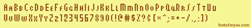 フォントAuxDotbitcCondSmallcaps – 茶色の文字が黄色の背景にあります。