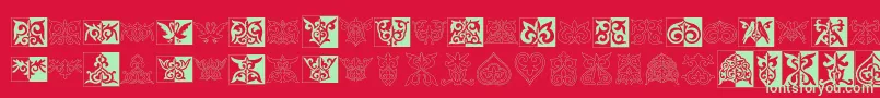 Prt Ornament2-Schriftart – Grüne Schriften auf rotem Hintergrund