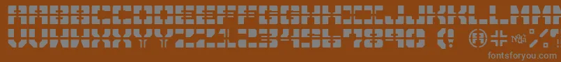 フォントDrawnAndQuartered – 茶色の背景に灰色の文字