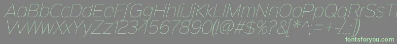 Czcionka Sinkinsans100thinitalic – zielone czcionki na szarym tle