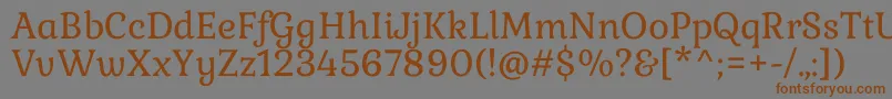 フォントGabrielaRegular – 茶色の文字が灰色の背景にあります。