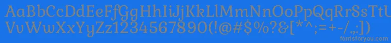 フォントGabrielaRegular – 青い背景に灰色の文字