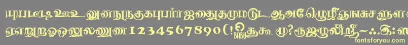 フォントNagananthiniRegular – 黄色のフォント、灰色の背景