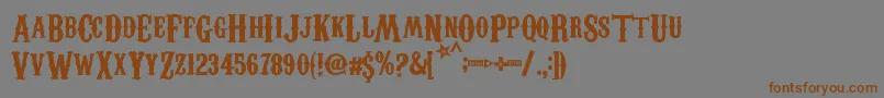 CarnivaleeFreakshow-Schriftart – Braune Schriften auf grauem Hintergrund