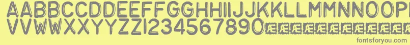 Embosst3-Schriftart – Graue Schriften auf gelbem Hintergrund