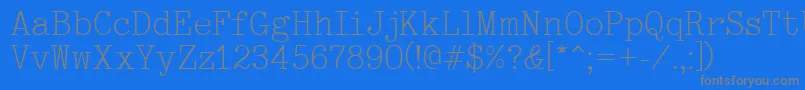 Typewriter-fontti – harmaat kirjasimet sinisellä taustalla