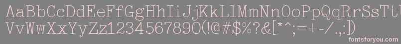 Typewriter-fontti – vaaleanpunaiset fontit harmaalla taustalla