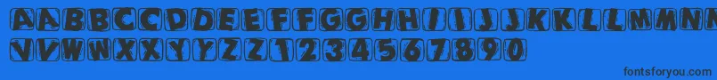 Woodcuttedcapsblack Font – Black Fonts on Blue Background