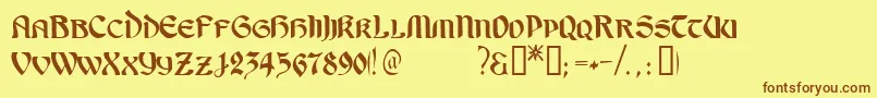 フォントOndineTM – 茶色の文字が黄色の背景にあります。