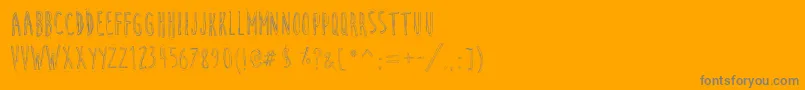 CuteCartoon-fontti – harmaat kirjasimet oranssilla taustalla