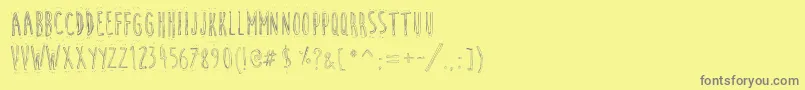 Fonte CuteCartoon – fontes cinzas em um fundo amarelo