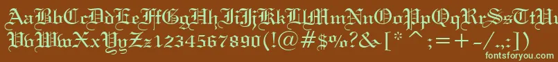 フォントWeddingTextBt – 緑色の文字が茶色の背景にあります。